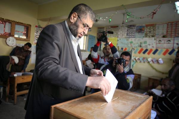 Egyptian senior member of the Muslim Brotherhood Khairat al-Shater casts his vote during the first round of Egypt's parliamentary elections