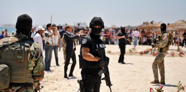Members of the Tunisian Security Services at the site of a terror attack on a beach outside the Imperial Marhaba Hotel, al-Sousse