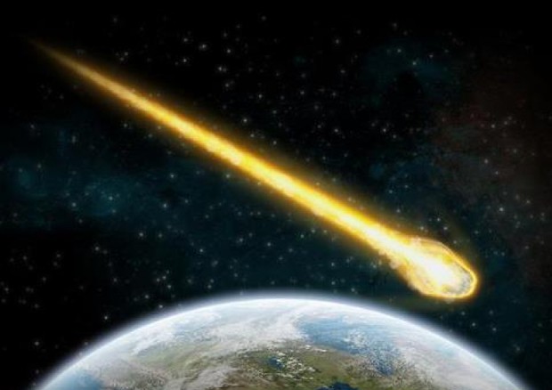 Rappresentazione artistica del passaggio di un asteroide vicino alla Terra © Ansa