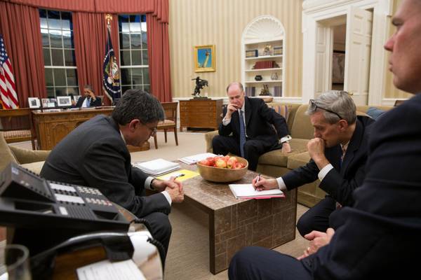 Obama talks on the phone with Egyptian President Mohammed Morsi in the Oval Office. Top avdisors in the foreground