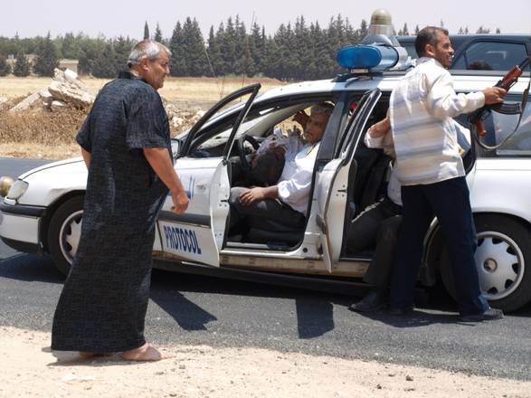 A picture taken by ANSA correspondent in Syria Claudio Accogli, moments after the attack against the Syrian police convoy that was escorting him. A policeman was killed in the car.