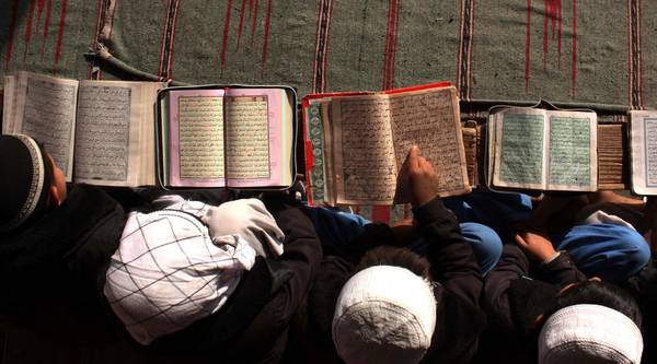 Muslim children learn to read the holy Koran