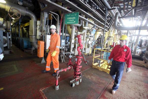 Libyans workers inspects the natural gas terminal of Mellitah