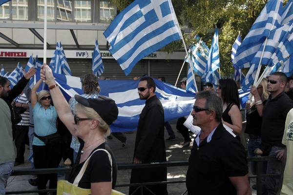 Supporters of far-right wing party Golden Dawn gathered in front of the Athens Police headquarters holding Greek flags to protest over the arrest of their party's leader