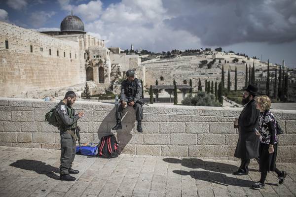 Israeli police officers stand guard at the entrance to the Al-Aqsa compound in Jerusalem's Old City