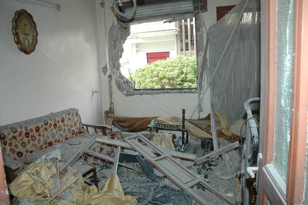 Damage caused by a mortar shell that fell on a house in Homs