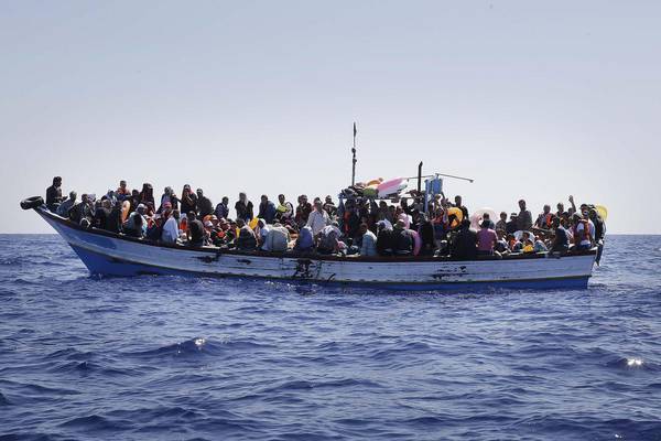 Migrants on a boat in the Sicily Straight