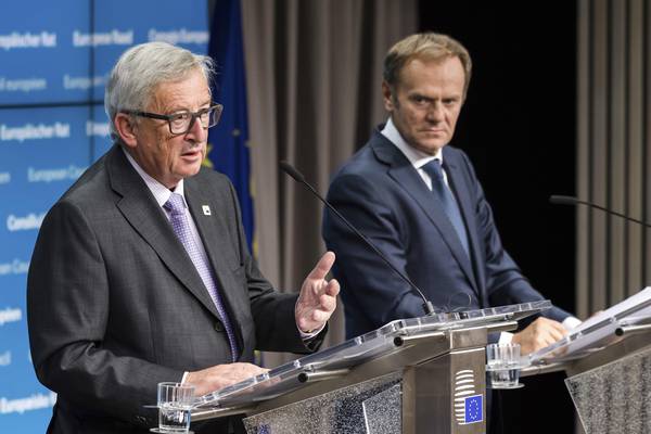 European Commission President Jean-Claude Juncker, left, and European Council President Donald Tusk address the media after the first day of an EU summit in Brussels early Friday