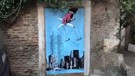11 settembre, nuovo murale Harry Greb a Roma con una mano che manovra l'attacco alle torri (ANSA)